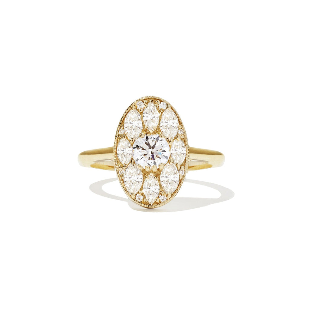 Gold ring with a diamond on a white background