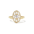 Gold ring with a diamond on a white background
