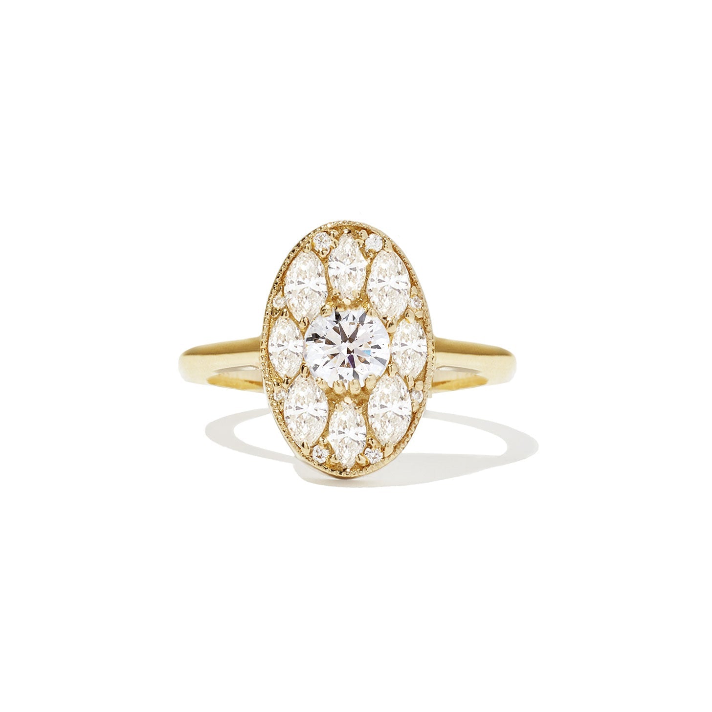 Gold ring with a diamond on a white background