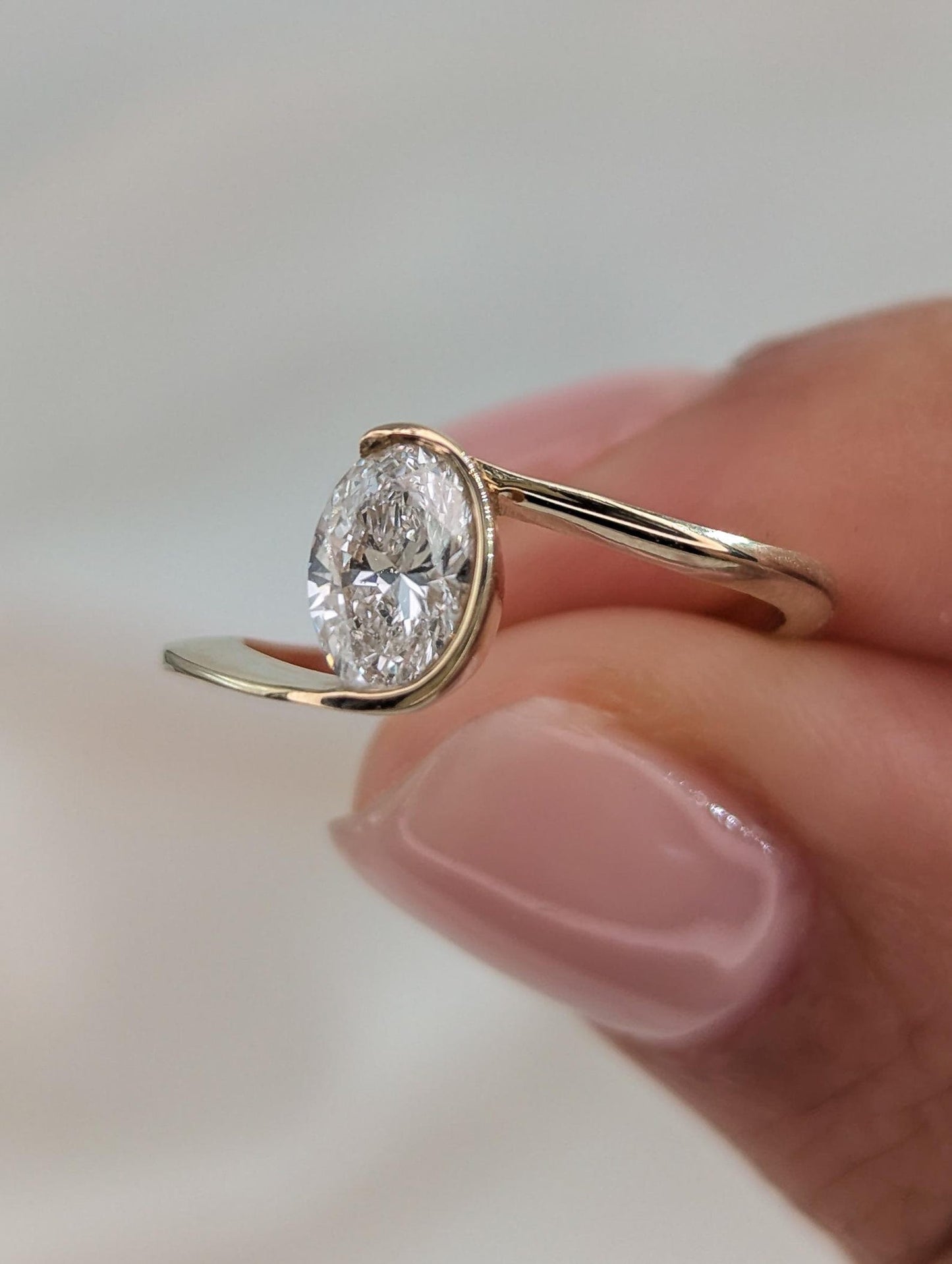 0.7 CT Oval Cut Half Bezel Unique Solitaire Moissanite Engagement Ring