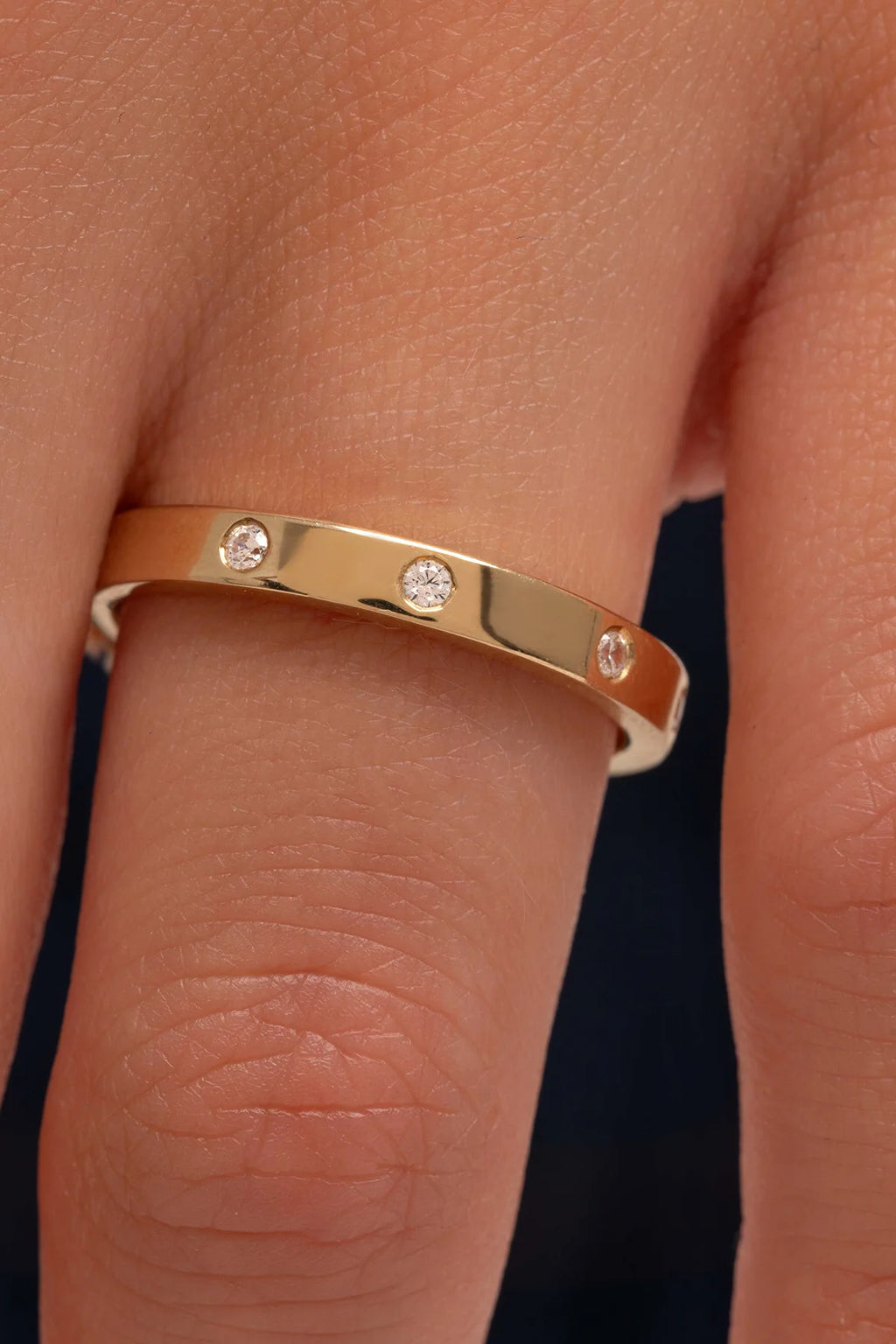 0.1 TCW Round Moissanite Flush Setting Wedding Band