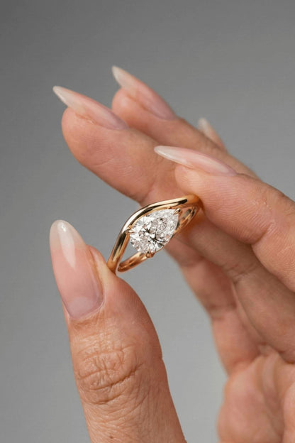 Pear Cut Floated Solitaire Moissanite Engagement Ring