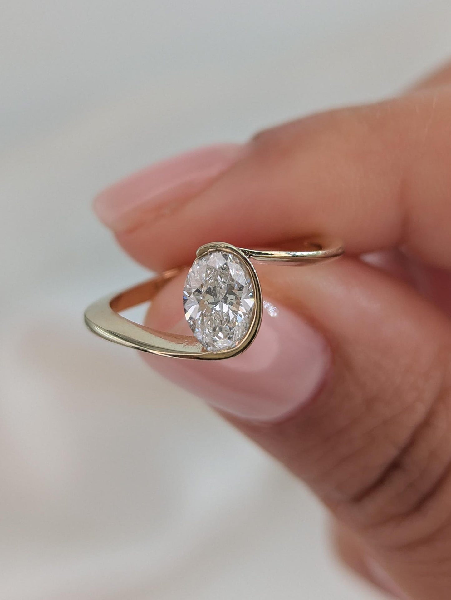 0.7 CT Oval Cut Half Bezel Unique Solitaire Moissanite Engagement Ring