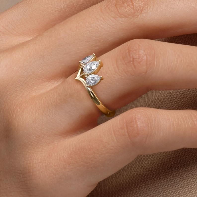 0.8 TCW Pear Cut Three Stone Crown Style Moissanite Engagement Ring