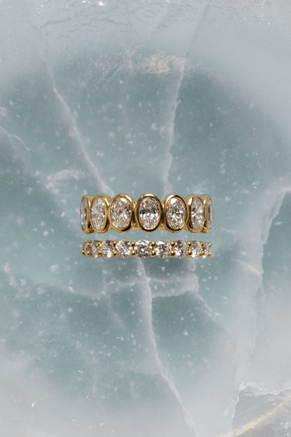 1.1 TCW Oval Moissanite Bezel Set Half Eternity Wedding Band