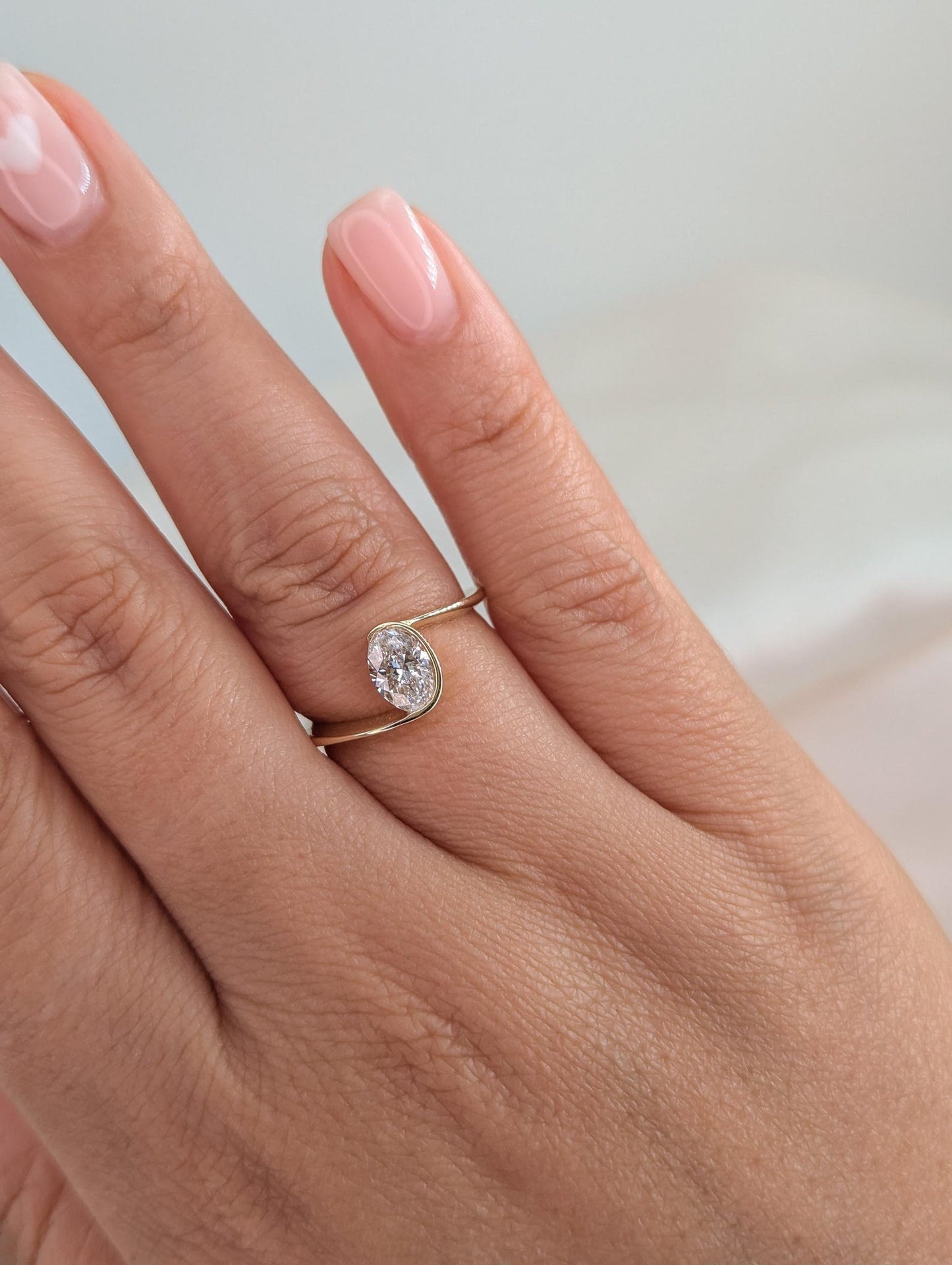 0.7 CT Oval Cut Half Bezel Unique Solitaire Moissanite Engagement Ring