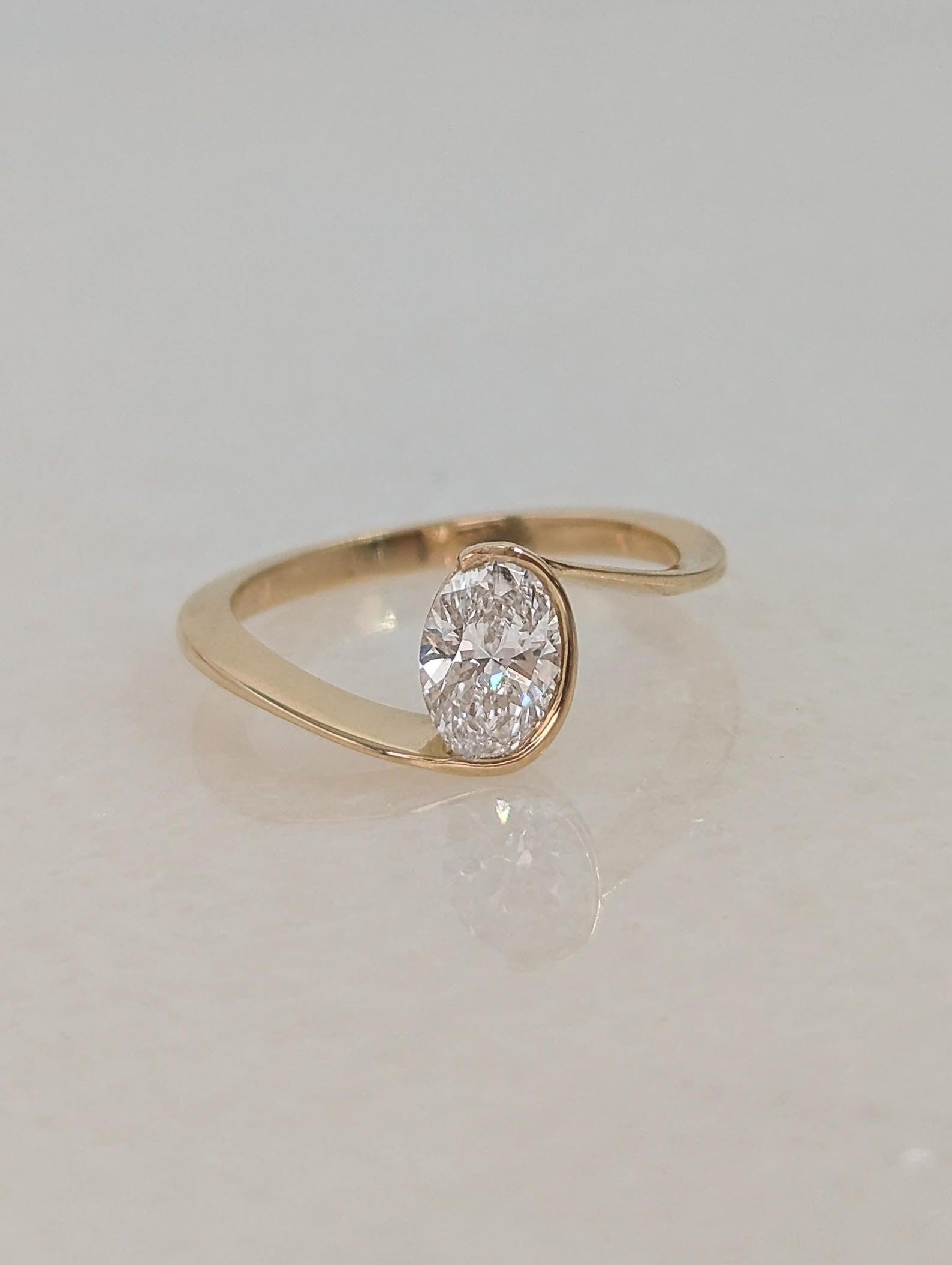 0.7 CT Oval Cut Half Bezel Unique Solitaire Moissanite Engagement Ring
