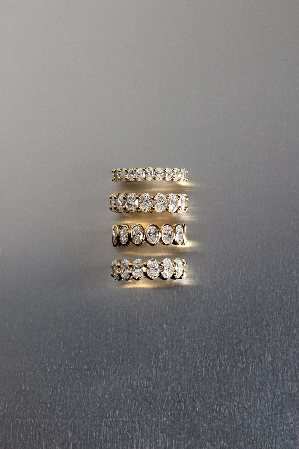 1.1 TCW Oval Moissanite Bezel Set Half Eternity Wedding Band
