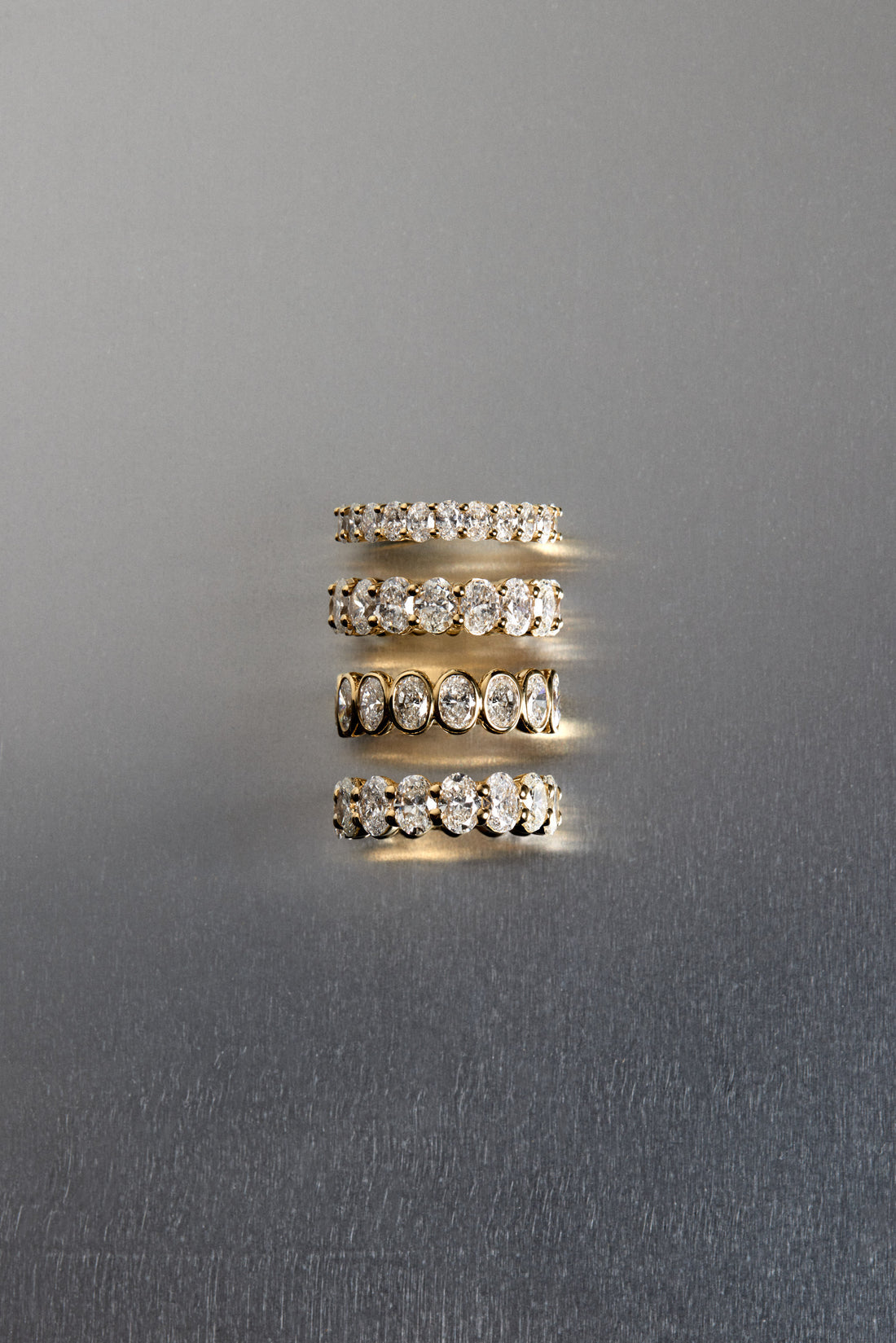1.1 TCW Oval Moissanite Bezel Set Half Eternity Wedding Band