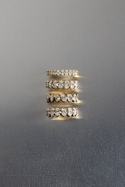 1.1 TCW Oval Moissanite Bezel Set Half Eternity Wedding Band