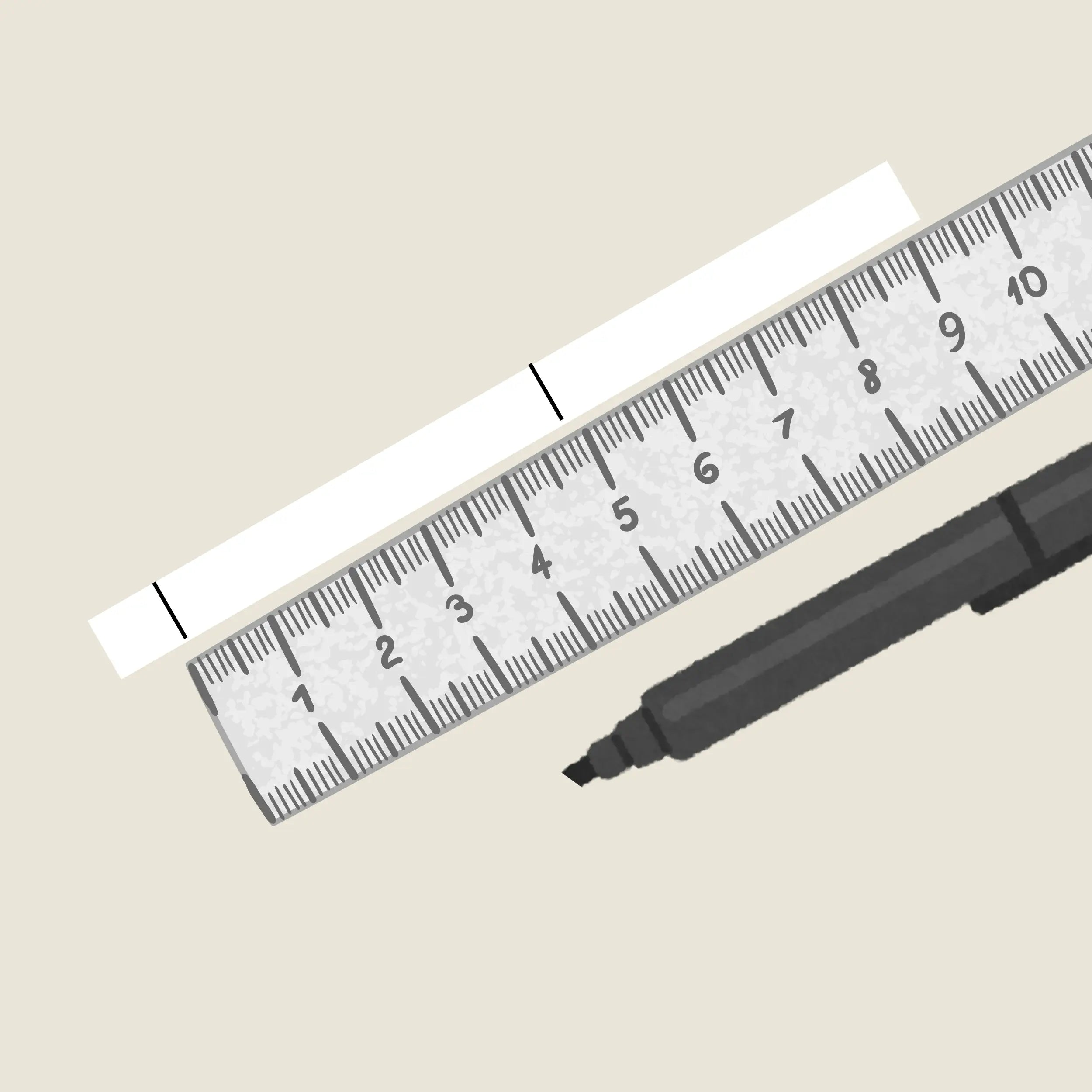 String or paper laid flat next to a ruler showing millimeter measurement